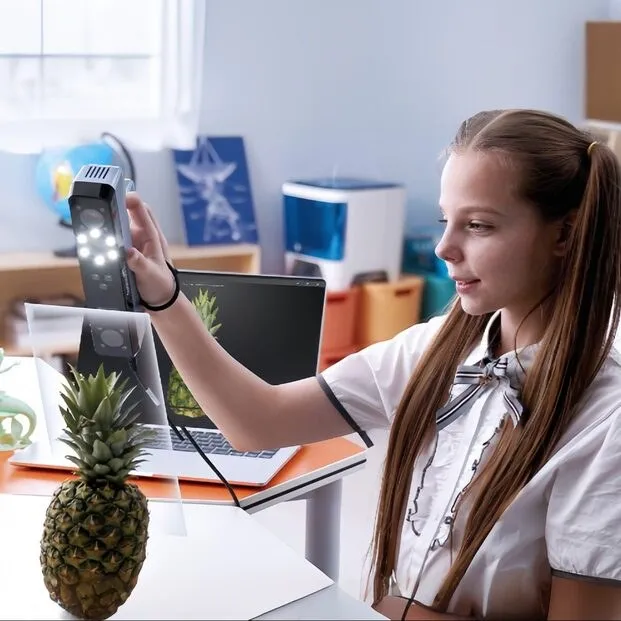 Girl 3D scanning an object with a tablet